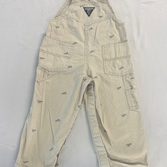 OshKosh B'gosh Kids Tan Overalls w/ embroidered paper airplane design - Picture 4 of 5